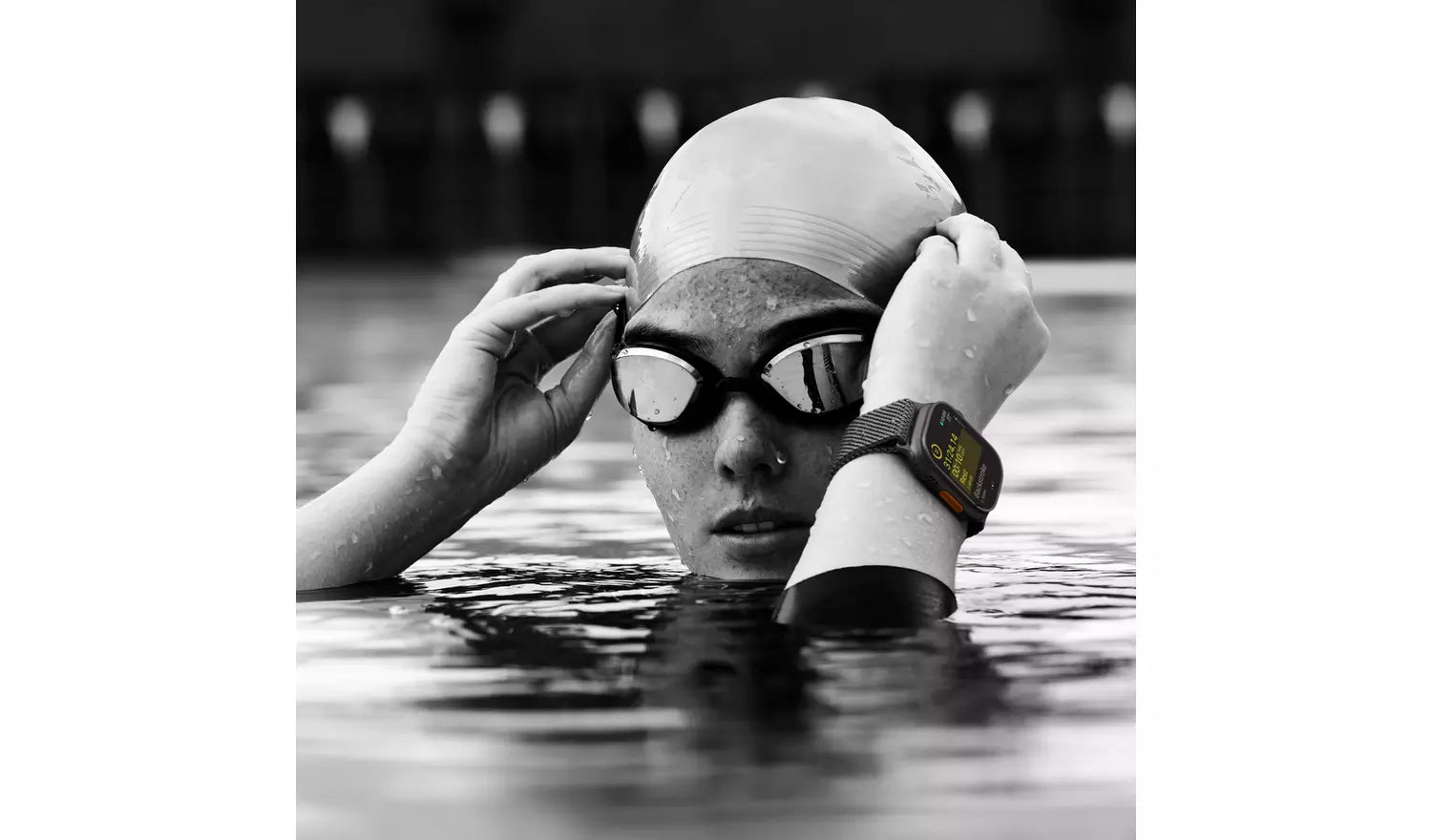 Apple Watch Ultra 2 on wrist with black Trail Loop S/M band, in water activity