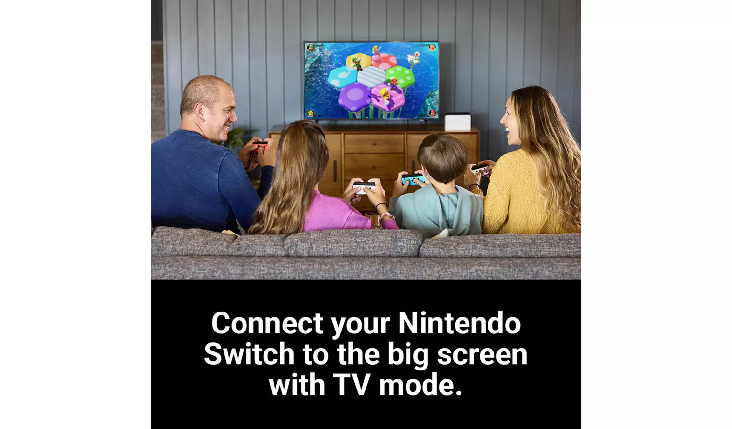 Switch OLED in TV-Modus, Konsole angeschlossen und Spielbild auf dem Fernseher
