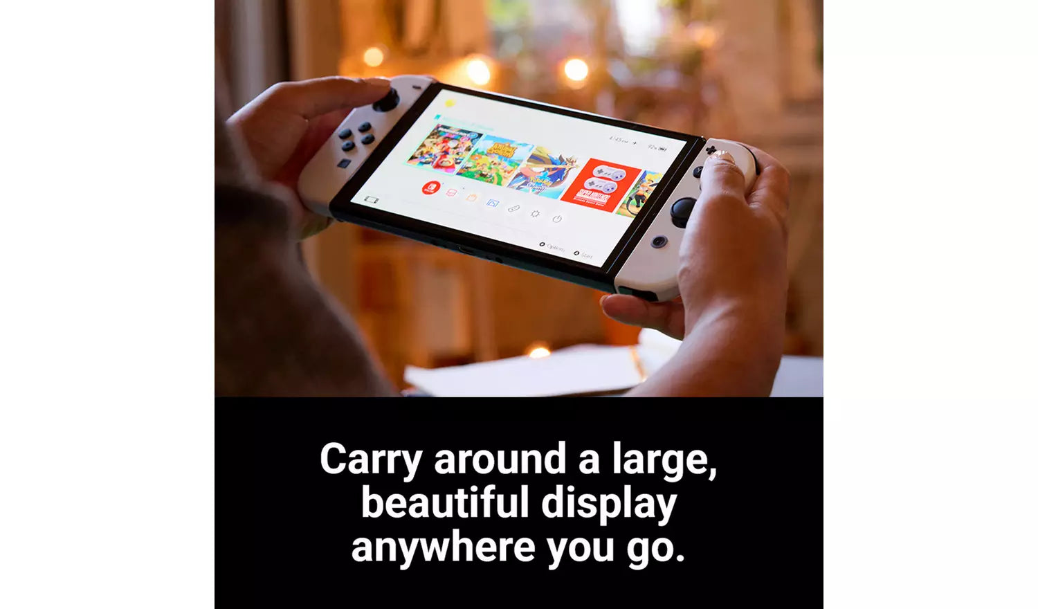 Weiße Switch OLED-Konsole in den Händen, Bildschirm mit Spielgrafik