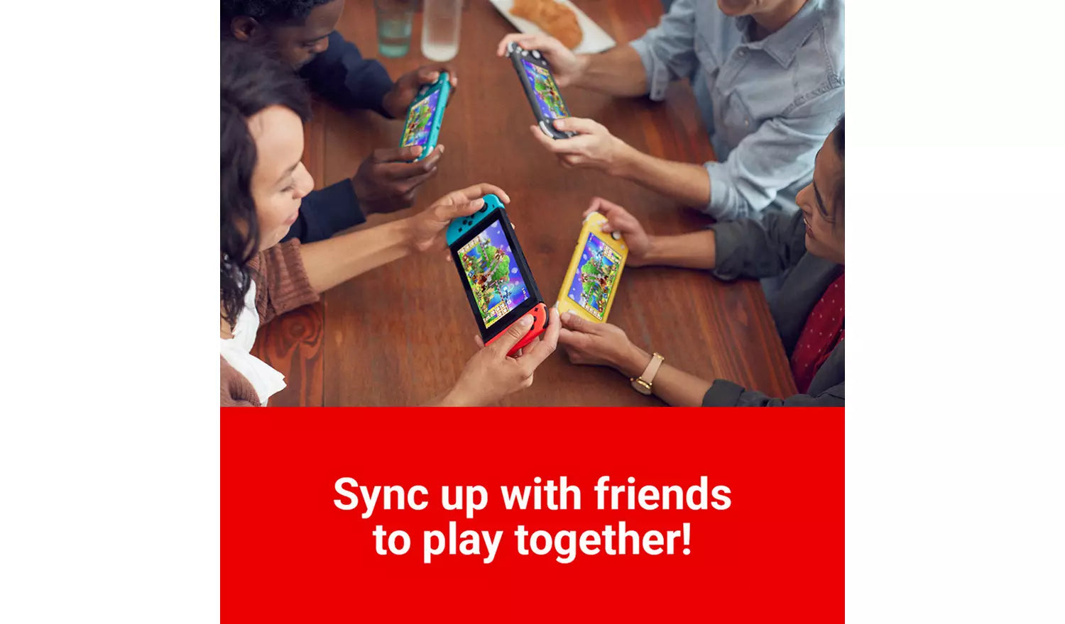 People holding turquoise handheld consoles with screens on around table