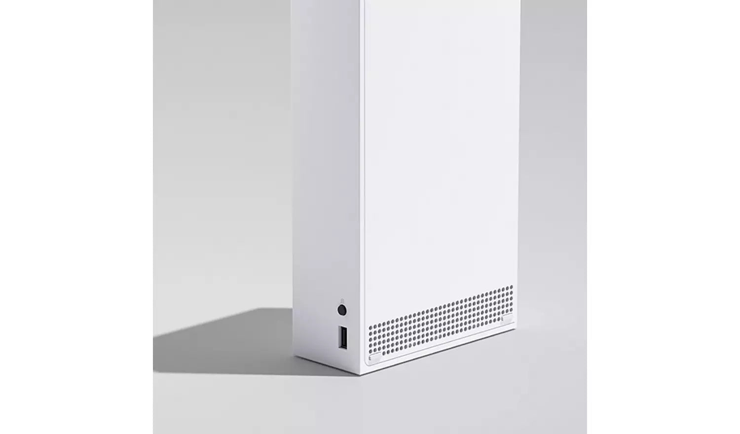 Xbox Series S side view showing USB port and perforated vent grille