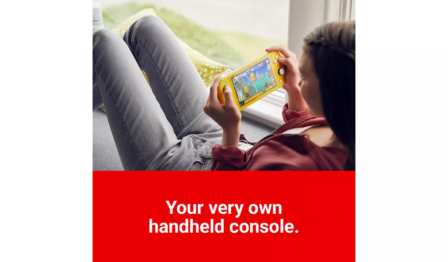 Nintendo Switch Lite coral handheld console, held by person with visible screen