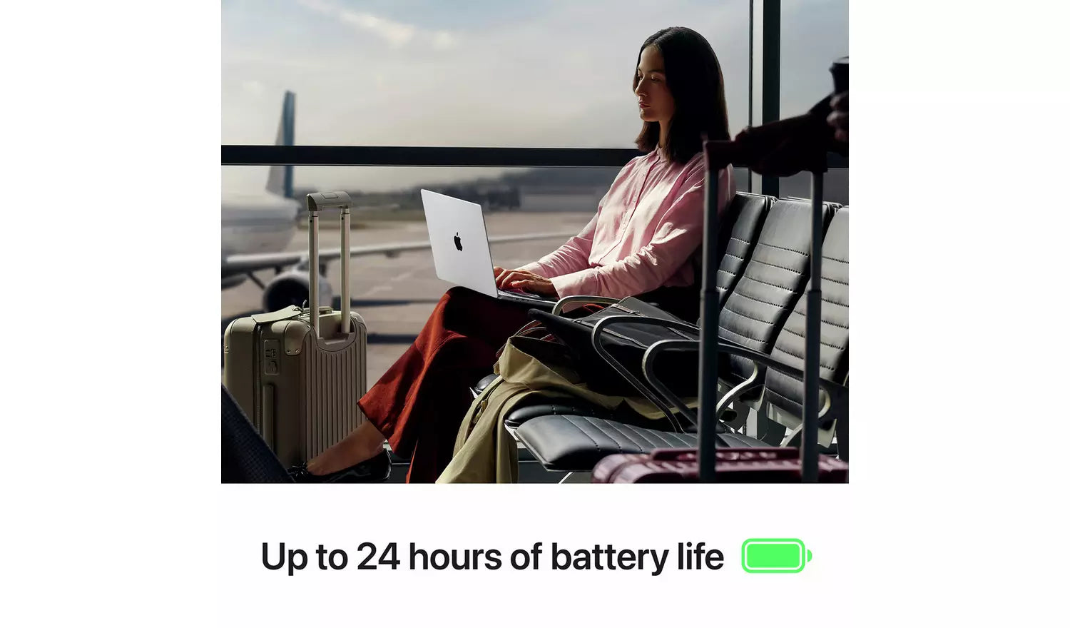 MacBook Pro in use with 'Up to 24 hours of battery life' text