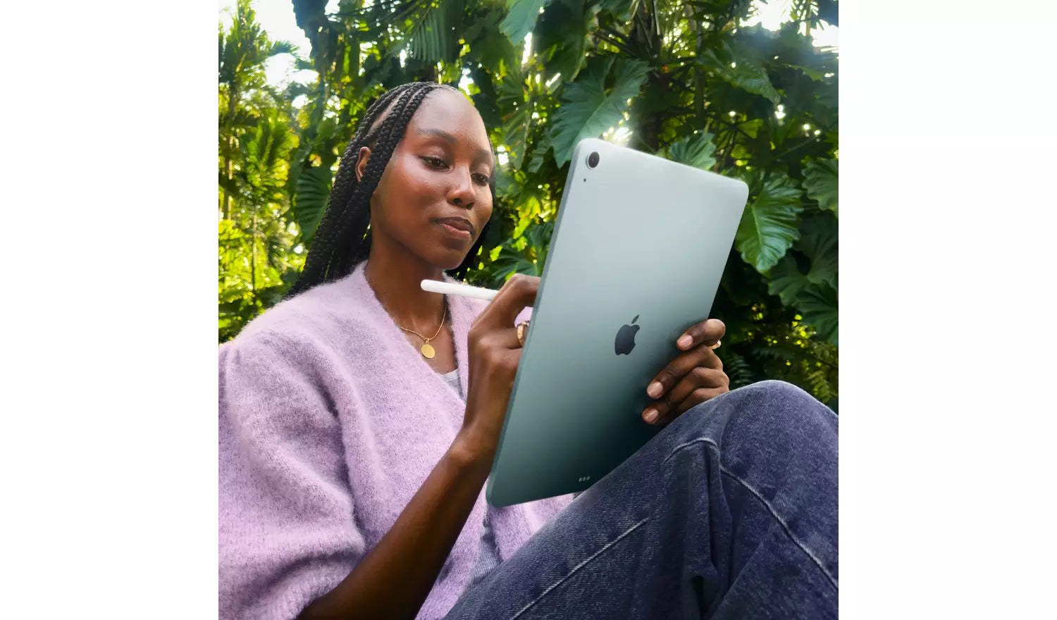 iPad Air 11-inch Blue tablet held in hands, Apple logo visible