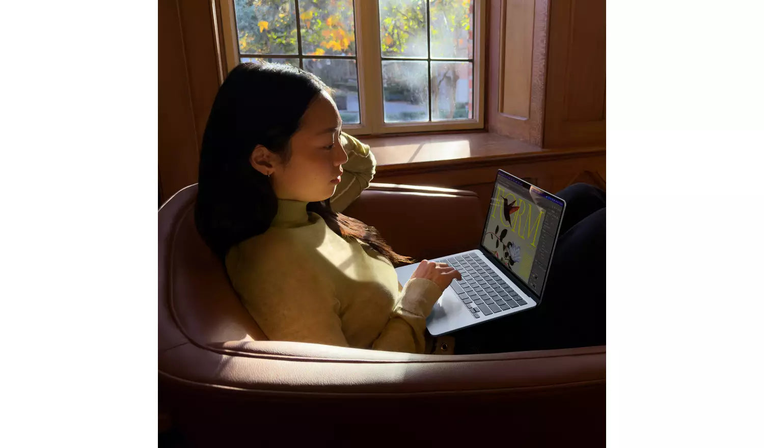 Sky Blue 13-inch MacBook Air with open screen on a lap